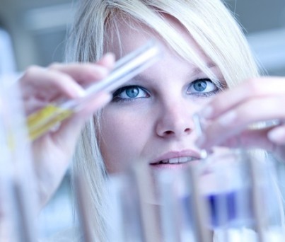 Closeup of a female researcher carrying out experiments in a lab
