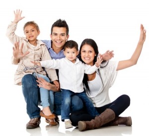 Happy family smiling with arms up - isolated over a white background