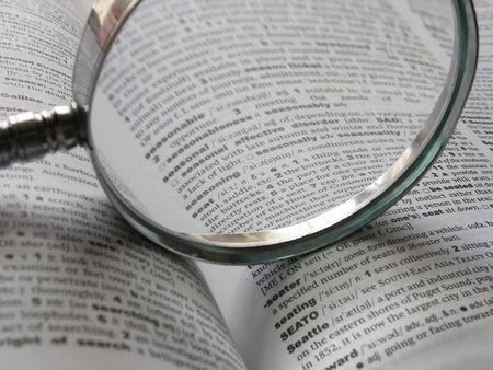 Magnifying glass on dictionary page