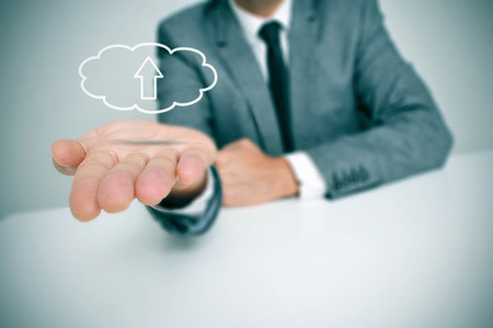 a man with a drawing of a cloud with an arrow inside, depicting the concept of upload to the cloud storage