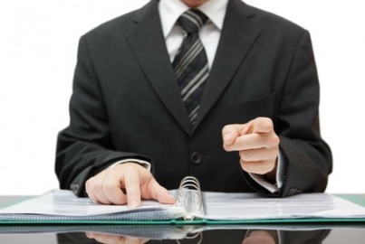 accountant or auditor pointing to you
