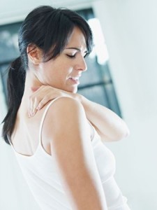 woman massaging neck. Side view, copy space