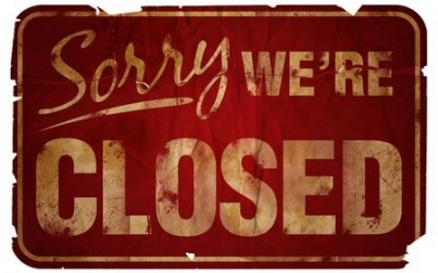 Aged Sorry We're Closed sign