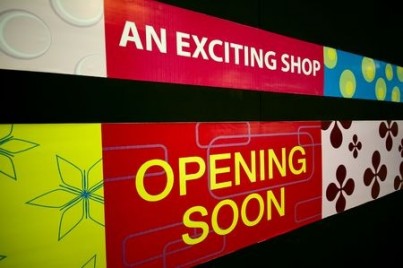 An Opening Soon signage at a shopping mall
