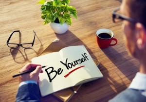 Businessman Writing the Words Be Yourself