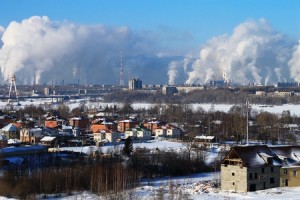 Cityscape with factory smoke in winter