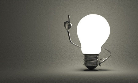 Glowing light bulb character with big metallic hands in moment of insight on gray textured background