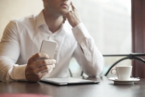 Man with smart phone on hand