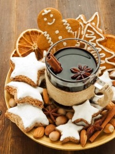 Mulled wine with spices and christmas cookies. Shallow dof