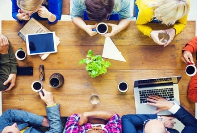 Multiethnic People with Startup Business Talking in a Cafe