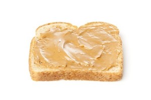 A peanut butter sandwhich against a white background