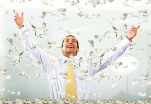 business success - man with lots of money smiling