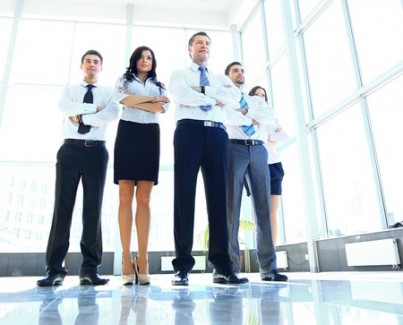 Portrait of businessman leading his team at office