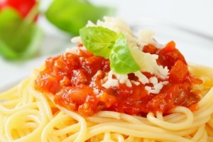 Spaghetti with meat-based tomato sauce and cheese