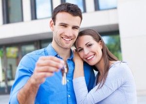 Couple with keys to new home