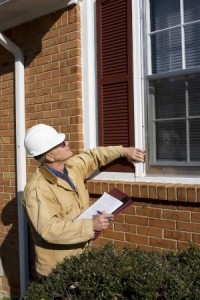 Home inspector looking for possible problems for a potential buyer, looking for needed repairs