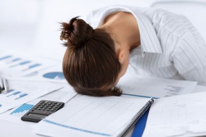 picture of woman sleeping at work in funny pose