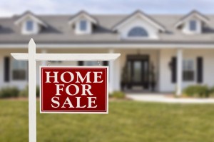 Home For Sale Real Estate Sign in Front of Beautiful New House