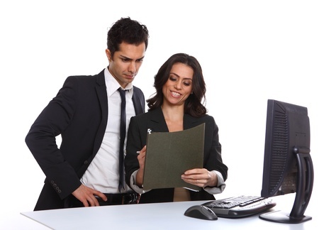 Business team looking over a file, isolated on white