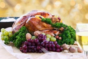 Roasted turkey on holiday table ready to eat. Selective focus on turkey.