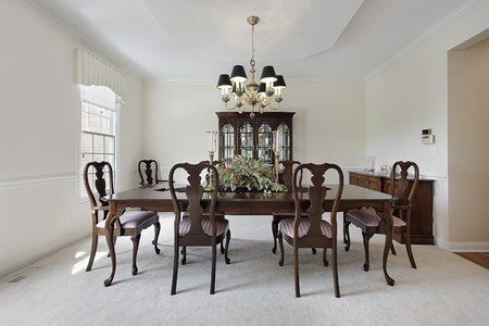 Traditional formal dining room with white carpeting