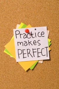 Practice Makes Perfect write on the paper on the cork board