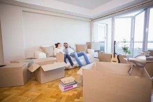 33937180 - cute couple taking a break from unpacking in their new home