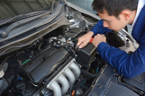 36848180 - auto mechanic (or technician) fixing car engine