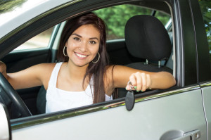 44950997 - teen holding up keys to her new car