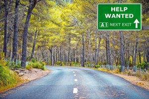 53612252 - help wanted road sign against clear blue sky