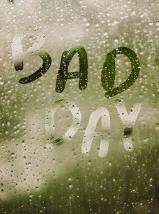 54657192 - text "bad day" written in a crystal with many drops.