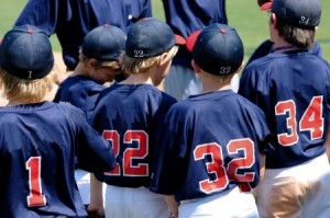 21656403 - team of baseball boys during a game in a huddle.