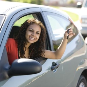 3569314 - teen driver inside car with keys smiles