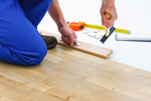 35806707 - carpenter worker installing laminate flooring in the room