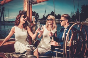 41535851 - stylish wealthy friends having fun on a luxury yacht