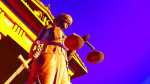 44295609 - lady justice sculpture of woman with sword and scale