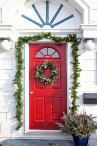 10058747 - a door of am older home decorated for christmas.