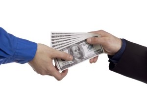 16984002 - portrait of two human hands holding money against white background