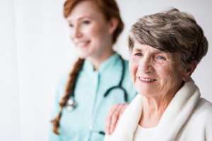 50497155 - senior female patient and supporting female doctor