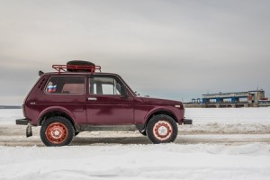 52245435 - truck on icy road with snowy landscape.