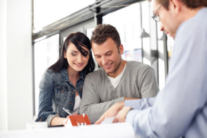 53952981 - young couple buying new home. meeting with architect.