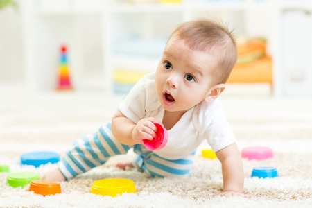 42644211 - little boy playing in children room