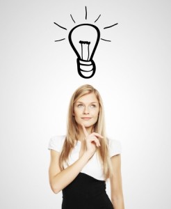 17539107 - businesswoman with lightbulb over head