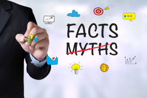 55508335 - facts  -myths     and businessman drawing landing page on blackboard