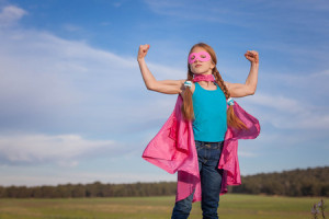 39240142 - girl power superhero confidence in kids or children