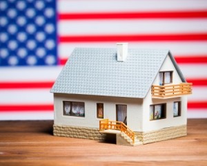 22903134 - usa real estate concept: house against american flag