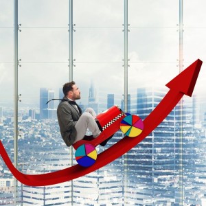 40649942 - businessman driving uphill arrow to economic growth