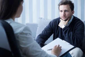 47867324 - young man during therapy at psychologist's office