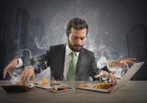 43642131 - stressed businessman working quickly with many computer