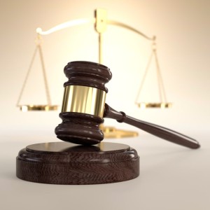 16306823 - 3d illustration of scales of justice and gavel on orange background